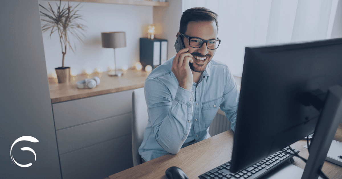 a man is happy at his independent financial advisor desk